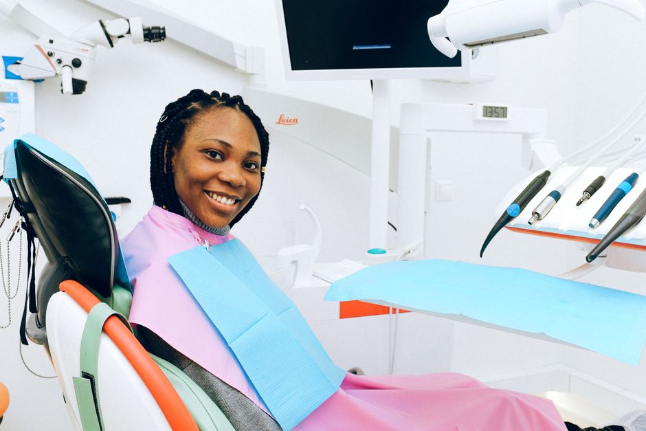 patient smiling in a dental chair during a routine checkup